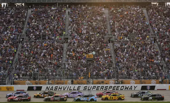 Drives speed past the green flag at the start of a NASCAR Cup Series auto race Sunday, June 1, 2025, in Lebanon, Tenn. (AP Photo/George Walker IV)