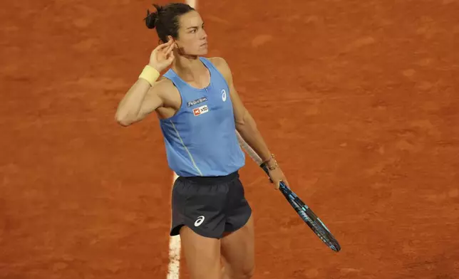 France's Lois Boisson celebrates after winning the first set against Russia's Mirra Andreeva during their quarterfinal match of the French Tennis Open at the Roland-Garros stadium in Paris, Wednesday, June 4, 2025. (AP Photo/Aurelien Morissard)