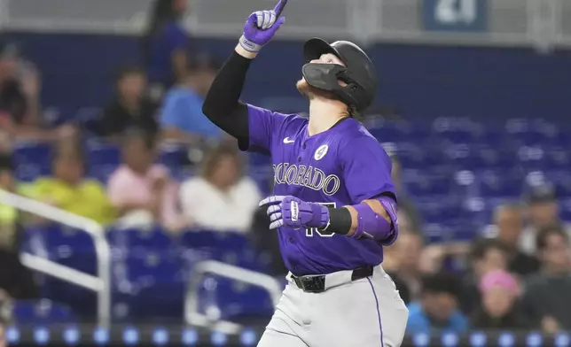 Colorado Rockies' Hunter Goodman crosses the plate after hitting a solo home run during the third inning of a baseball game against the Miami Marlins, Monday, June 2, 2025, in Miami. (AP Photo/Lynne Sladky)