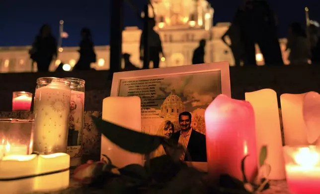 A candlelight vigil for former House Speaker Melissa Hortman and her husband Mark, who were fatally shot, at the state Capitol, Wednesday, June 18, 2025, in St. Paul, Minn. (AP Photo/Nikolas Liepins)