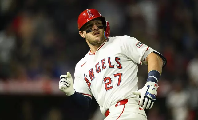 Los Angeles Angels' Mike Trout looks on after hitting a sacrifice fly to score a run during the eighth inning of a baseball game against the Athletics, Monday, June 9, 2025, in Anaheim, Calif. (AP Photo/William Liang)