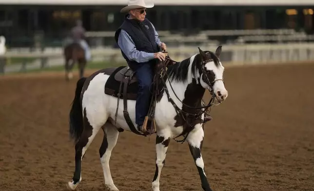 FILE - Trainer D. Wayne Lukas watches a workout at Churchill Downs May 1, 2025, in Louisville, Ky. (AP Photo/Charlie Riedel, File)