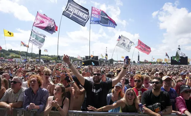 Festivalgoers during the Glastonbury Festival in Worthy Farm, Somerset, England, Friday, June 27, 2025. (Scott A Garfitt/Invision/AP)