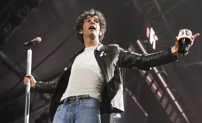 Matty Healy of The 1975 performs during the Glastonbury Festival in Worthy Farm, Somerset, England, Friday, June 27, 2025. (Scott A Garfitt/Invision/AP)