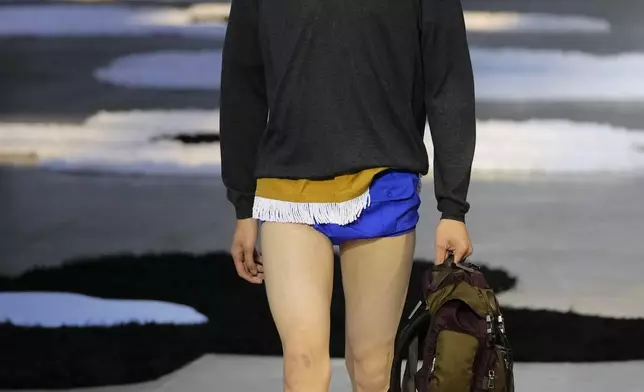 A model wears a creation as part of the men's Prada Spring-Summer 2026 collection, that was presented in Milan, Italy, Sunday, June 22, 2025. (AP Photo/Luca Bruno)