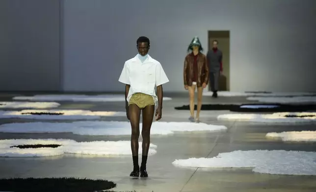 A model wears a creation as part of the men's Prada Spring-Summer 2026 collection, that was presented in Milan, Italy, Sunday, June 22, 2025. (AP Photo/Luca Bruno)