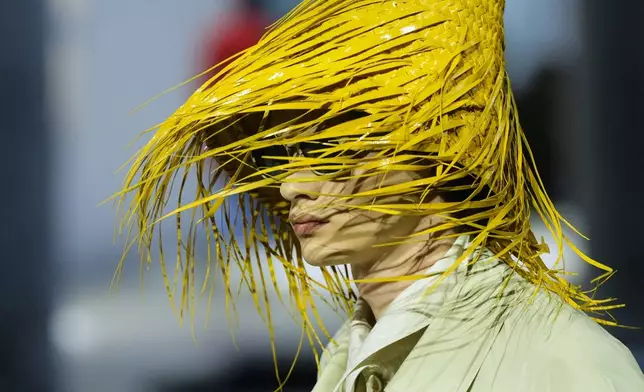 A model wears a creation as part of the men's Prada Spring-Summer 2026 collection, that was presented in Milan, Italy, Sunday, June 22, 2025. (AP Photo/Luca Bruno)