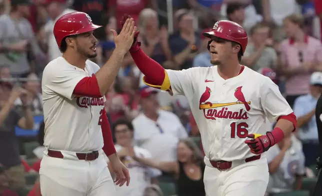 St. Louis Cardinals' Nolan Gorman (16) is congratulated by teammate Nolan Arenado after hitting a two-run home run during the sixth inning of a baseball game against the Chicago Cubs Monday, June 23, 2025, in St. Louis. (AP Photo/Jeff Roberson)