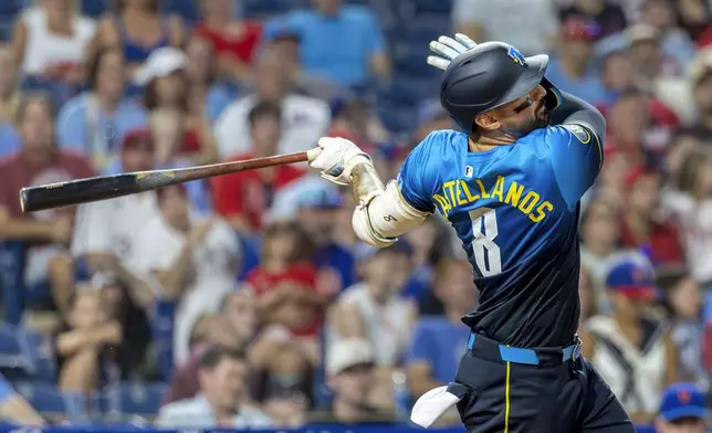 Philadelphia Phillies Nick Castellanos follows through on a solo home run during the eighth inning of a baseball game against the New York Mets, Friday, June 20, 2025, in Philadelphia. (AP Photo/Laurence Kesterson)