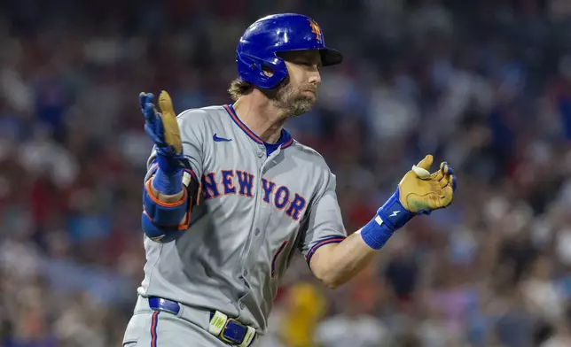 New York Mets' Jeff McNeil runs the bases after hitting a solo home run in the sixth inning of a baseball game against the Philadelphia Phillies, Friday, June 20, 2025, in Philadelphia. (AP Photo/Laurence Kesterson)