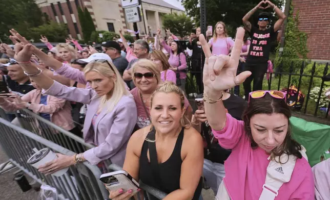 Supporters of Karen Read gesture as Read departs Norfolk Superior Court for the day during jury deliberations at her trial, Tuesday, June 17, 2025, in Dedham, Mass. (AP Photo/Charles Krupa)