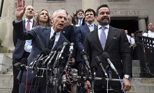 William Read, left, father of Karen Read, behind him, speaks after she was found not guilty of second-degree murder on Wednesday, June 18, 2025, in Dedham, Mass. (AP Photo/Josh Reynolds)