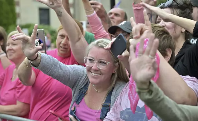 Nichole Tellier, a resident of Cape Cod, Mass., center, and fellow supporters of Karen Read, react as she leaves the courthouse at the start of the third day of jury deliberations in Read's trial at Norfolk Superior Court, Wednesday, June 18, 2025, in Dedham, Mass. (AP Photo/Josh Reynolds)