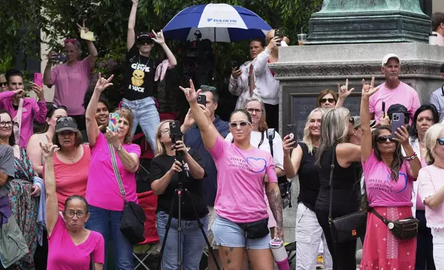 Supporters of Karen Read gesture as Read departs Norfolk Superior Court during jury deliberations at her trial, Tuesday, June 17, 2025, in Dedham, Mass. (AP Photo/Charles Krupa)