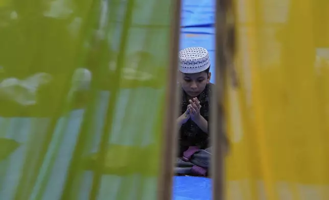A Muslim devotee offers Eid al-Adha prayers in Chennai, India, Saturday, June 7, 2025. (AP Photo/Mahesh Kumar A.)