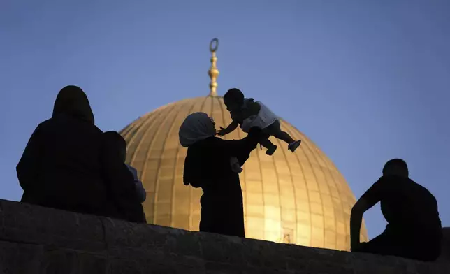 Muslim worshipers gather for Eid al-Adha prayers next to the Dome of the Rock shrine at the Al Aqsa Mosque compound in Jerusalem's Old City, Friday, June 6, 2025. (AP Photo/Mahmoud Illean)
