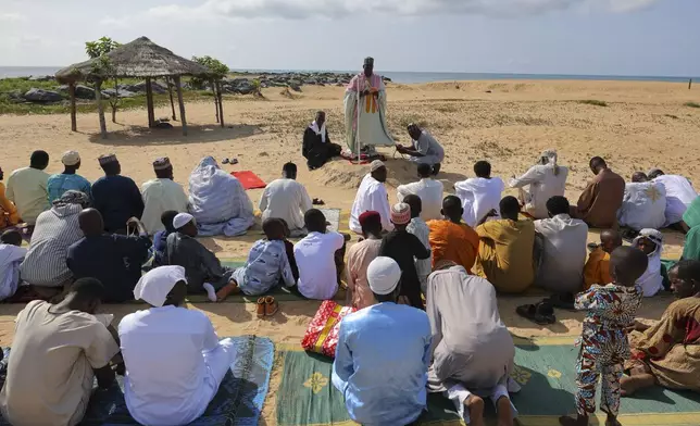 Muslims gather for Eid al-Adha prayers at a beach in Keta, Ghana, Friday, Jun 6, 2025 (AP Photo/Misper Apawu)