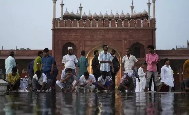 Devotees perform ablutions before praying at Jama Masjid on the morning of the Muslim festival of Eid al-Adha in New Delhi, India, Saturday, June 7, 2025. (AP Photo/Karma Bhutia)