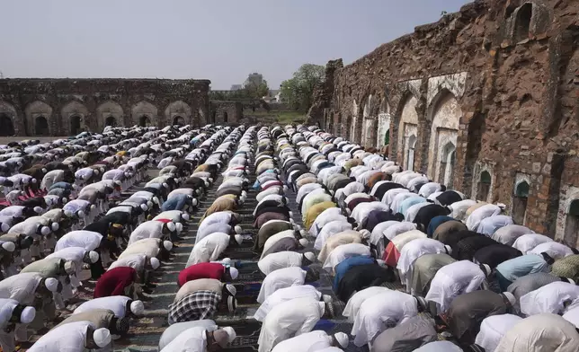 Devotees pray at Firoz Shah Kotla on the morning of the Muslim festival of Eid al-Adha in New Delhi, India, Saturday, June 7, 2025. (AP Photo/Karma Bhutia)