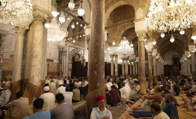Muslims gather to perform Eid al-Adha prayers at Zaytuna Mosque in Tunis, Tunisia, Friday, June 6, 2025. (AP Photo/Anis Mili)