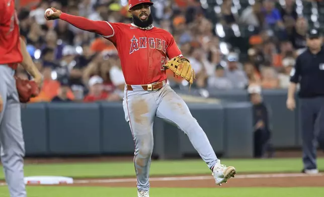 Los Angeles Angels third baseman Luis Rengifo fields a ground ball to record an out in the bottom of the third inning of a baseball game against the Baltimore Orioles, Friday, June 13, 2025, in Baltimore. (AP Photo/Alyssa Howell)