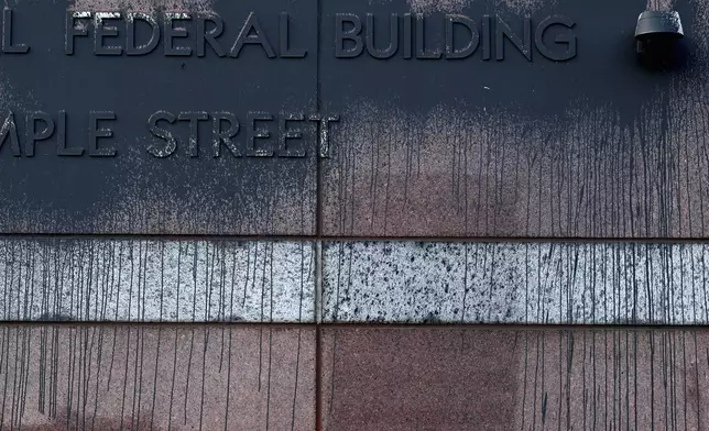 Spray paint remains on the Edward R. Roybal Federal Building Tuesday, June 17, 2025, in Los Angeles. (AP Photo/Wally Skalij)