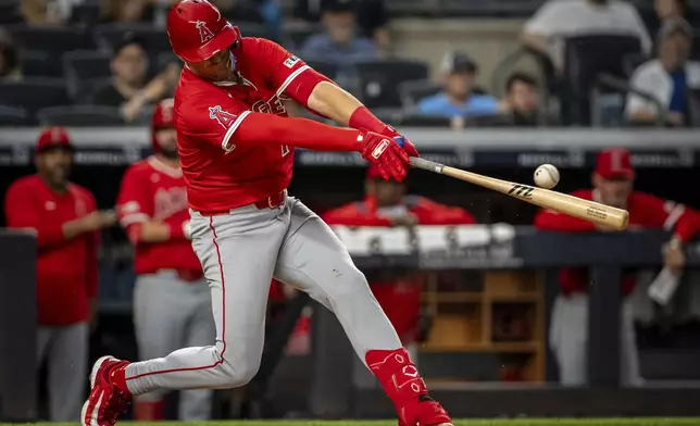 Los Angeles Angels' Kevin Newman (10) hits a single during the fifth inning of a baseball game against the New York Yankees, Wednesday, June 18, 2025, in New York. (AP Photo/Angelina Katsanis)