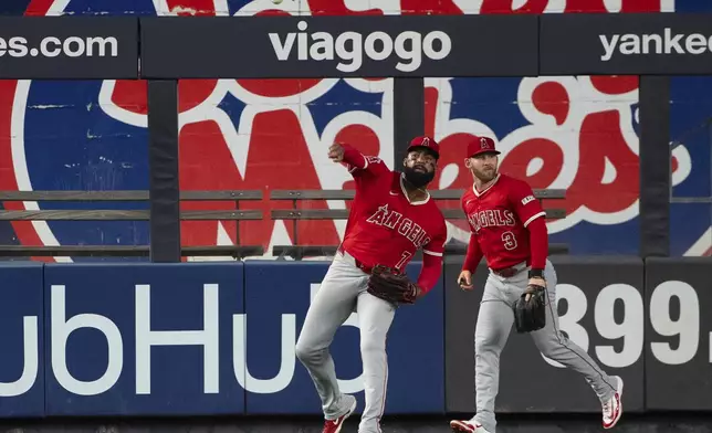 Los Angeles Angels outfielder Jo Adell (7) catches and returns New York Yankees' Paul Goldschmidt's fly out ball during the fourth inning of a baseball game, Wednesday, June 18, 2025, in New York. (AP Photo/Angelina Katsanis)