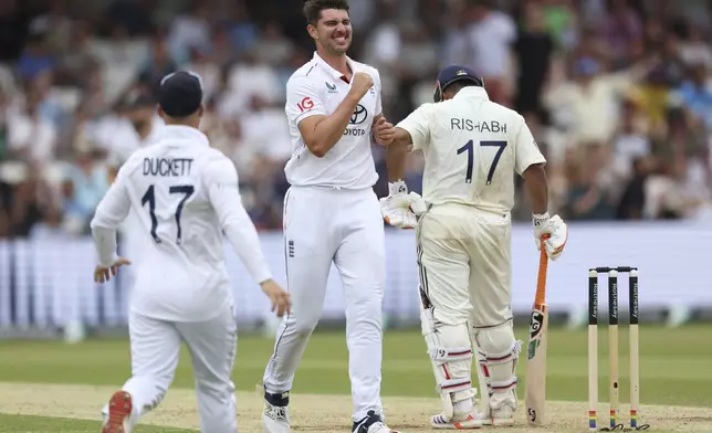 England's Josh Tongue, center, celebrates the dismissal of India's Rishabh Pant, right, on day two of the first cricket test match between England and India at Headingley in Leeds, England, Saturday, June 21, 2025, (AP Photo/Scott Heppell)