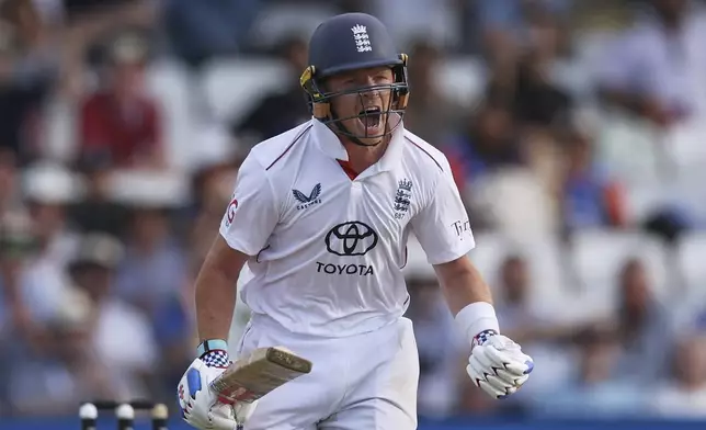 England's Ollie Pope celebrates after scoring a century on day two of the first cricket test match between England and India at Headingley in Leeds, England, Saturday, June 21, 2025. (AP Photo/Scott Heppell)