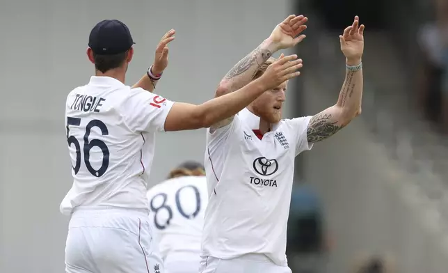 England's captain Ben Stokes, right, celebrate the dismissal of India's Shardul Thakur on day two of the first cricket test match between England and India at Headingley in Leeds, England, Saturday, June 21, 2025, (AP Photo/Scott Heppell)