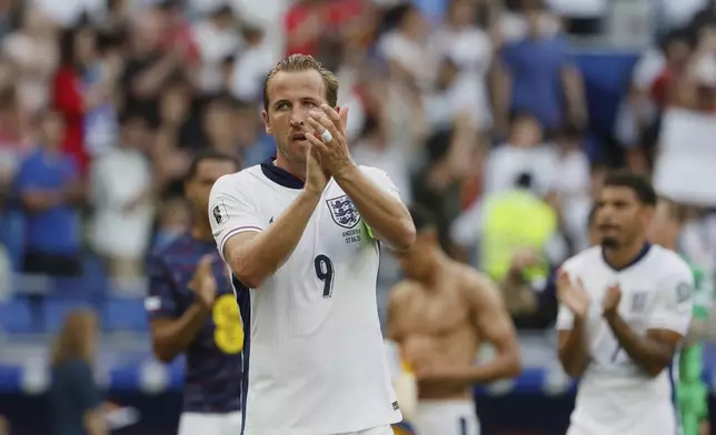 England's Harry Kane applauds to supporters at the end of a World Cup 2026 group K qualifying soccer match between Andorra and England at the RCDE Stadium in Barcelona, Spain, Saturday, June 7, 2025. (AP Photo/Joan Monfort)