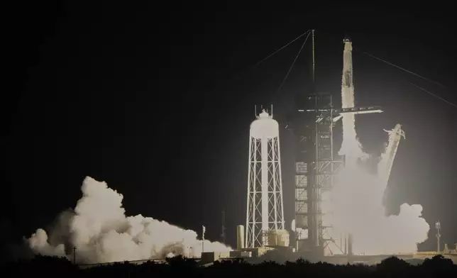 A SpaceX Falcon 9 rocket with a crew of four aboard a Dragon Spacecraft lifts off from pad 39A at the Kennedy Space Center in Cape Canaveral, Fla., Wednesday, June 25, 2025. (AP Photo/John Raoux)