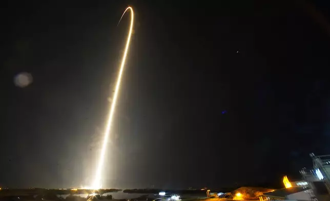 A SpaceX Falcon 9 rocket with a crew of four aboard a Dragon Spacecraft lifts off from pad 39A at the Kennedy Space Center in Cape Canaveral, Fla., Wednesday, June 25, 2025. (AP Photo/John Raoux)