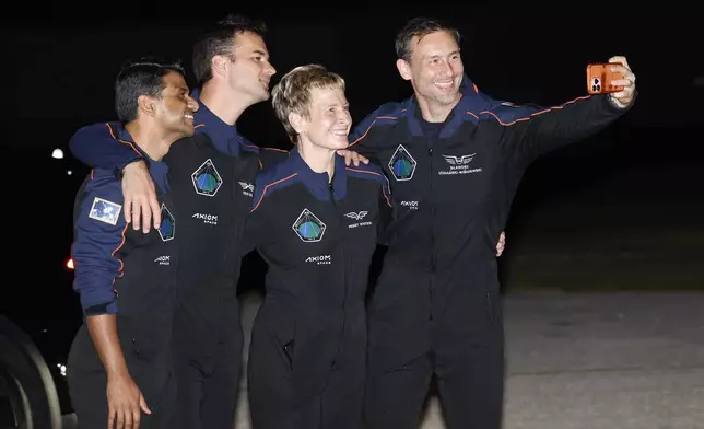 SpaceX Falcon 9 crew, Shubhanshu Shukla of the Indian Space Research Organization, from left, Tibor Kapu of Hungary, commander Peggy Whitson, and Slawosz Uznanski-Wisniewski of Poland, pose for a selfie before departing for a launch to the International Space Station at the Kennedy Space Center in Cape Canaveral, Fla., Tuesday, June 24, 2025. (AP Photo/Terry Renna)