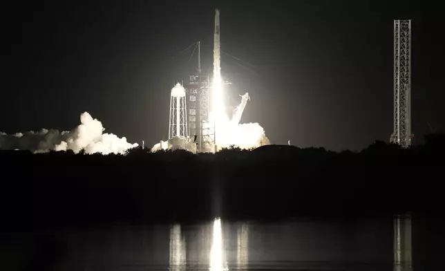 A SpaceX Falcon 9 rocket with a crew of four aboard a Dragon Spacecraft lifts off from pad 39A at the Kennedy Space Center in Cape Canaveral, Fla., Wednesday, June 25, 2025. (AP Photo/Terry Renna)