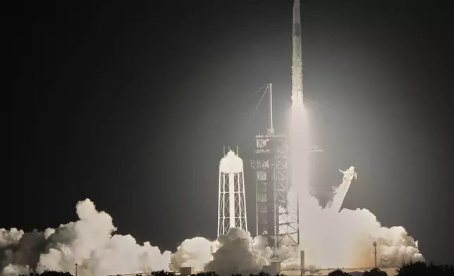 A SpaceX Falcon 9 rocket with a crew of four aboard a Dragon Spacecraft lifts off from pad 39A at the Kennedy Space Center in Cape Canaveral, Fla., Wednesday, June 25, 2025. (AP Photo/John Raoux)
