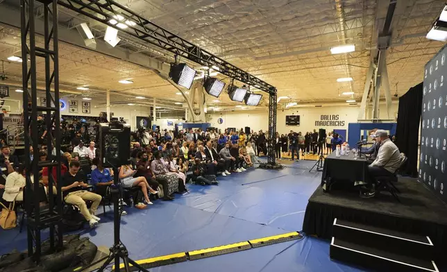 Dallas Mavericks' Cooper Flagg, the No. 1 overall pick in the NBA draft, at podium with head coach Jason Kidd, right, responds to questions during an NBA basketball press conference at the team's practice facility, Friday, June 27, 2025, in Dallas. (AP Photo/Tony Gutierrez)