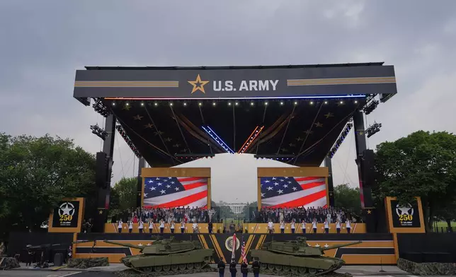 The colors are presented as President Donald Trump attends a military parade commemorating the Army's 250th anniversary, coinciding with his 79th birthday, Saturday, June 14, 2025, in Washington. (AP Photo/Julia Demaree Nikhinson)