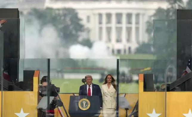 President Donald Trump and first lady Melania Trump arrive for a military parade commemorating the Army's 250th anniversary, coinciding with his 79th birthday, Saturday, June 14, 2025, in Washington. (AP Photo/Julia Demaree Nikhinson)