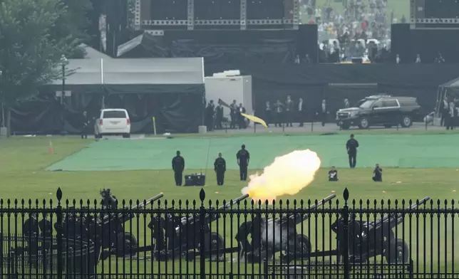 Members of the military fire cannons as part of a 21-gun salute during an event to honor the Army's 250th anniversary, coinciding with President Donald Trump's 79th birthday, Saturday, June 14, 2025, in Washington. (AP Photo/Mark Schiefelbein)