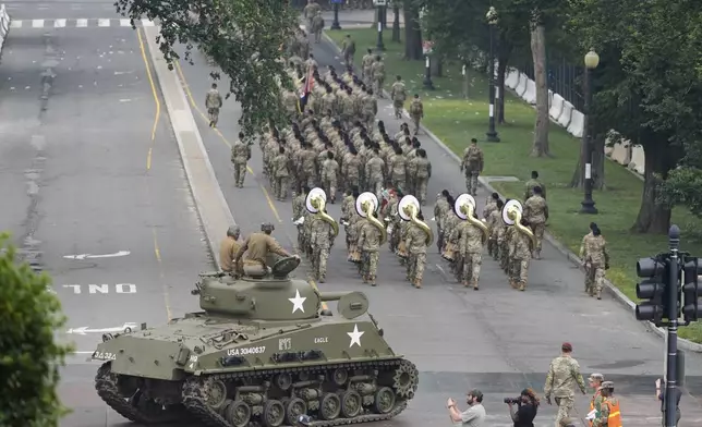 A military parade commemorating the Army's 250th anniversary, coinciding with President Donald Trump's 79th birthday, Saturday, June 14, 2025, in Washington. (AP Photo/Stephanie Scarbrough)