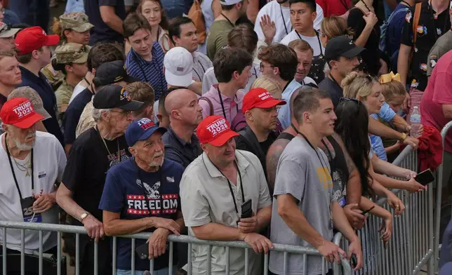 People attend a military parade commemorating the Army's 250th anniversary, coinciding with his 79th birthday, Saturday, June 14, 2025, in Washington. (AP Photo/Julia Demaree Nikhinson)