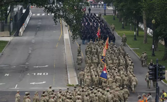 A military parade commemorating the Army's 250th anniversary, coinciding with President Donald Trump's 79th birthday, Saturday, June 14, 2025, in Washington. (AP Photo/Stephanie Scarbrough)