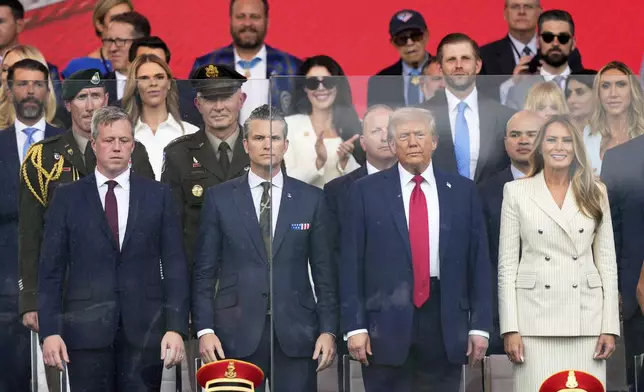 President Donald Trump, first lady Melania Trump, Secretary of the Army Daniel Driscoll, left and Defense Secretary Pete Hegseth attend a military parade commemorating the Army's 250th anniversary, coinciding with his 79th birthday, Saturday, June 14, 2025, in Washington. (AP Photo/Julia Demaree Nikhinson)
