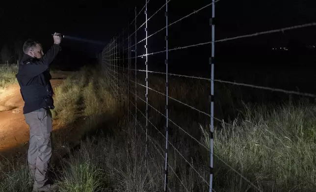 Dewet Ungerer, an AfriForum coordinator, patrols a road during a neighborhood and farm security watch operation in Bashewa area, near Pretoria, South Africa, March 27, 2025. (AP Photo/Alet Pretorius)