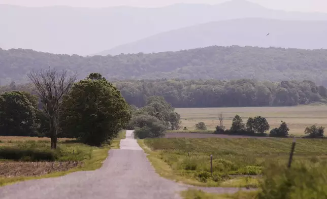 Hazy skies due to smoke from wildfires in Canada are seen over the Green Mountains on Wednesday, June 4, 2025, in Addison, Vt. (AP Photo/Amanda Swinhart)