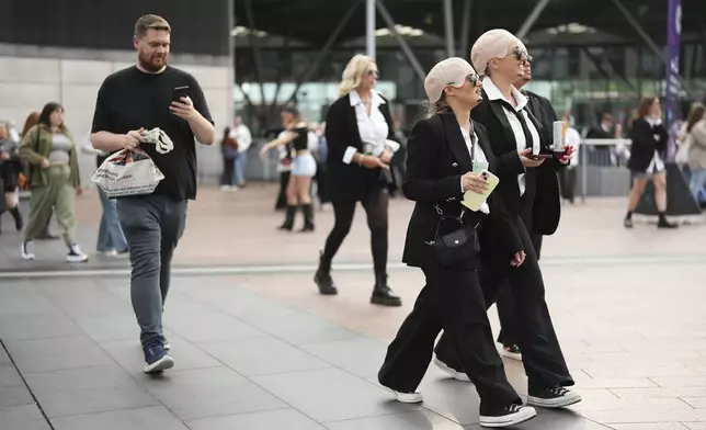 Fans exit North Greenwich Station prior to a performance by Pitbull on Monday, June 9, 2025, in London. (Photo by Scott A Garfitt/Invision/AP)