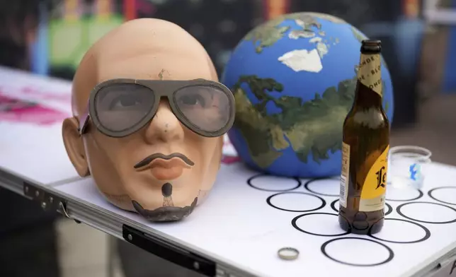 A Pitbull mask on a beer pong table on Monday, June 9, 2025, in London. (Photo by Scott A Garfitt/Invision/AP)