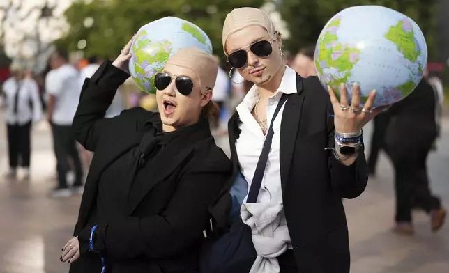 Fans gather in front of the O2 Arena prior to a performance by Pitbull on Monday, June 9, 2025, in London. (Photo by Scott A Garfitt/Invision/AP)